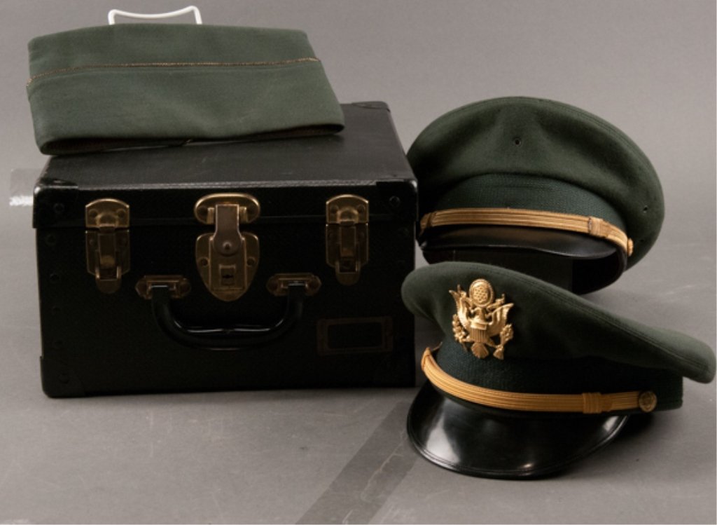 Two (2) US Army Visor Caps in Box: One is complete and has Morry, Luxenberg label. The other is missing cap device and has moth damage in back. In box and includes overseas cap.