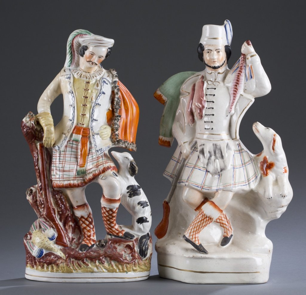 Two (2) 19th C. Staffordshire Scottish Hunters: Both with firearm and dog. 15 1/4" H Provenance: Estate of Robert V. Hatcher, Jr.