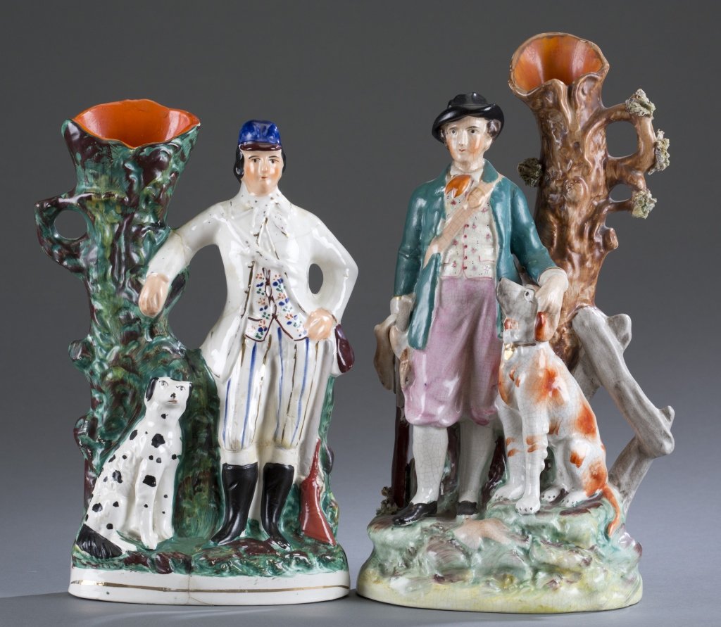 Two (2) 19th C. Staffordshire Hunter Spill Vases: Each spill vase with dog companion and hunting attire. Tallest: 13 1/2" H Provenance: Estate of Robert V. Hatcher, Jr.