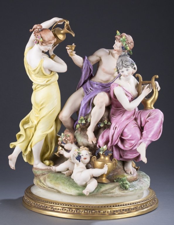Giuseppe G. Cappe Calle Italian Porcelain Figures: Capo-di-Monte style, ca. 1960 Figural grouping of Bacchus figure with woman and nymphs. Marked on base G. Calle, Works of Art Italy, 99048.