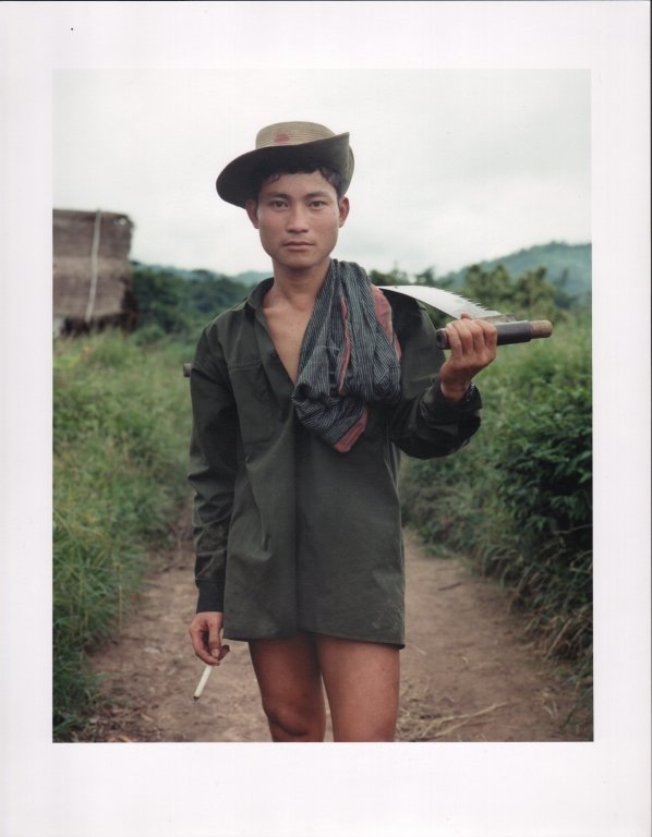 Chan Chao, (Burmese / Kalemyo, b. 1966): Karen Soldier, 1996 From the series Burma: Something Went Wrong Chromogenic print 11 3/16" x 9", frame: 17 3/4" x 14 3/4" Denied a visa to his native Burma (now Myanmar), Chao twice visited border reg