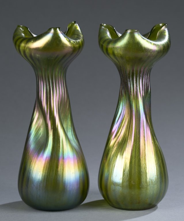 Pair of Loetz-Style Green Iridescent Vases: Magenta highlights. Folded rim and pinched body. Unmarked. 9 3/4" H