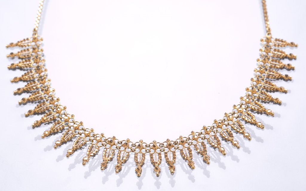 22K Gold Cast Necklace: Single line of floral drops. High-polish finish. Unmarked, tested 22K. 14 dwt. 16" L