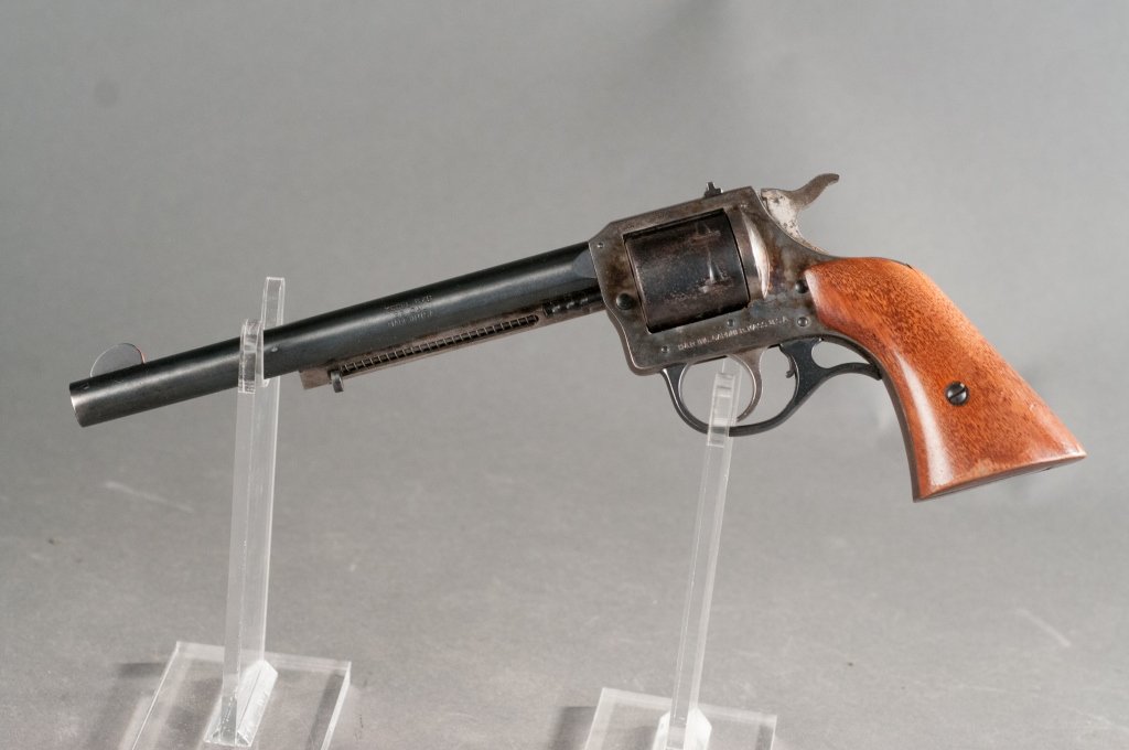 Harrington & Richardson Model 676 .22 Revolver: Serial #AU053552. Overall 90% case and blue finish. Grips are very good. Cylinder has light rust and pitting. 7.5" barrel. 13" overall. Provenance: The Estate of Walter T. Price, Jr. of Orange, VA.