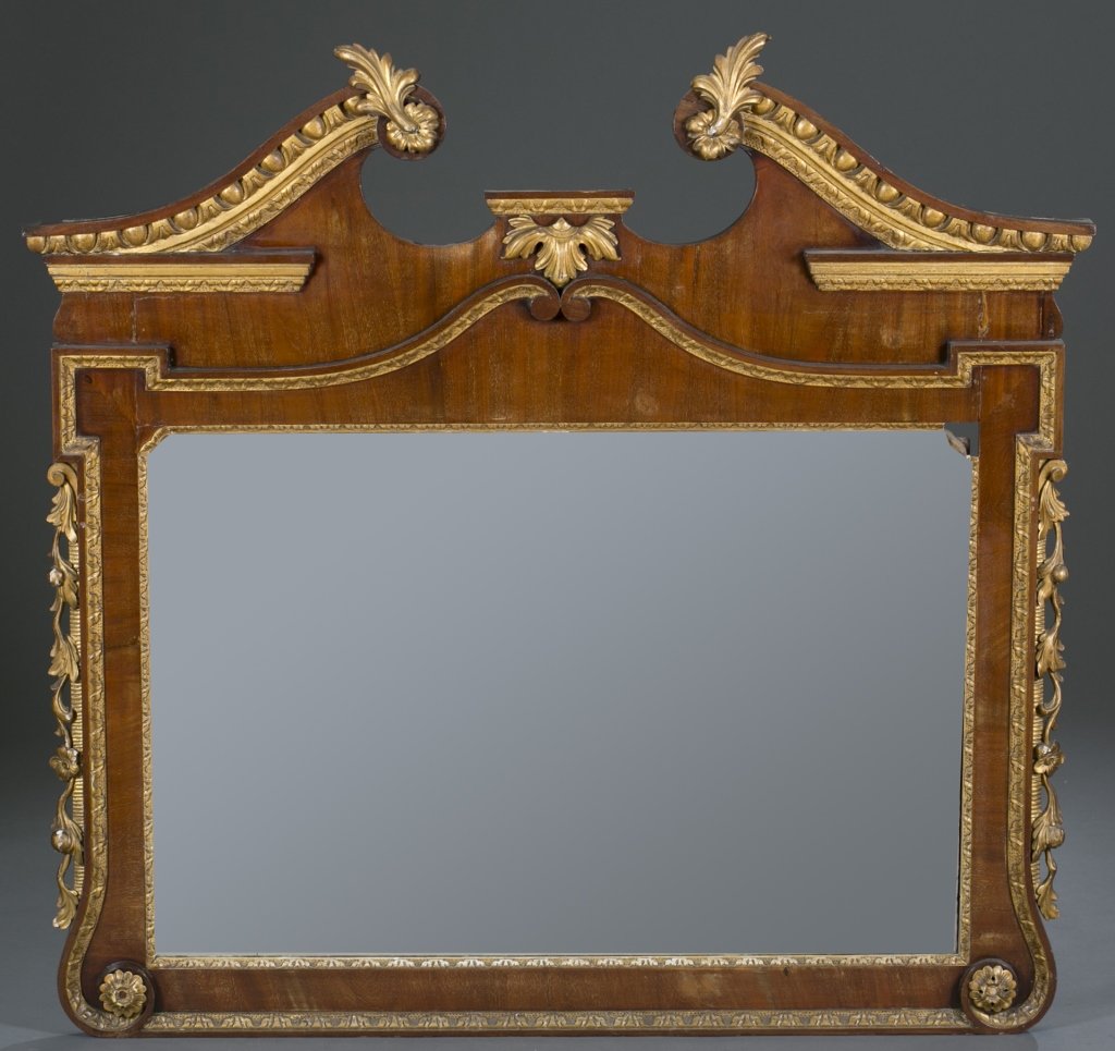 Federal Hall Mirror: Broken arch with gilt and gesso applications, bell flower drops on sides, beveled mirror. Gilt corner missing on part of mirror and missing finial. 44" H x 44" W Provenance: The Estate of Robert V. Ha