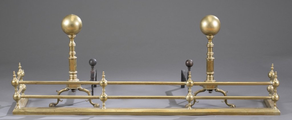 Three Piece 19th c. Brass Fireplace Set: Two cannon ball form andirons with fender. 20 1/2" H