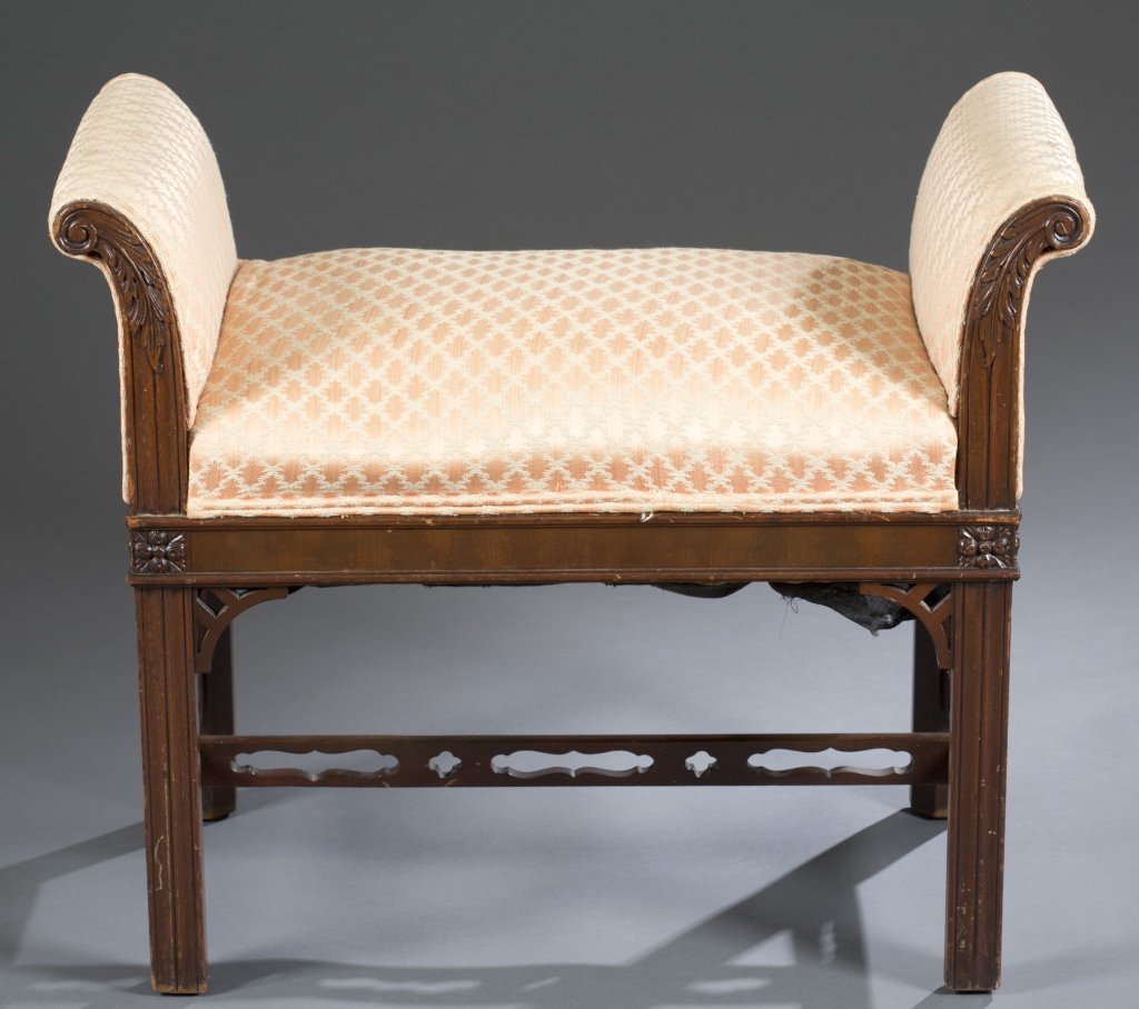 George III Chinese Chippendale Window Bench: Scrolled arms with acanthus leaves ending on rosette blocks. Straight legs with central reeding supported by pierced "H" stretcher. Cushion filled with horse hair. 24" H x 29" W x 14" D