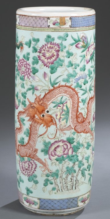 Late Qing Famille Rose Umbrella Stand: Enameled with flowers and dragons on a pale blue ground with brocade borders. Provenance: Purchased from Christie's, June 4, 1997, Lot 187 24" H Condition: Not perfectly round body.