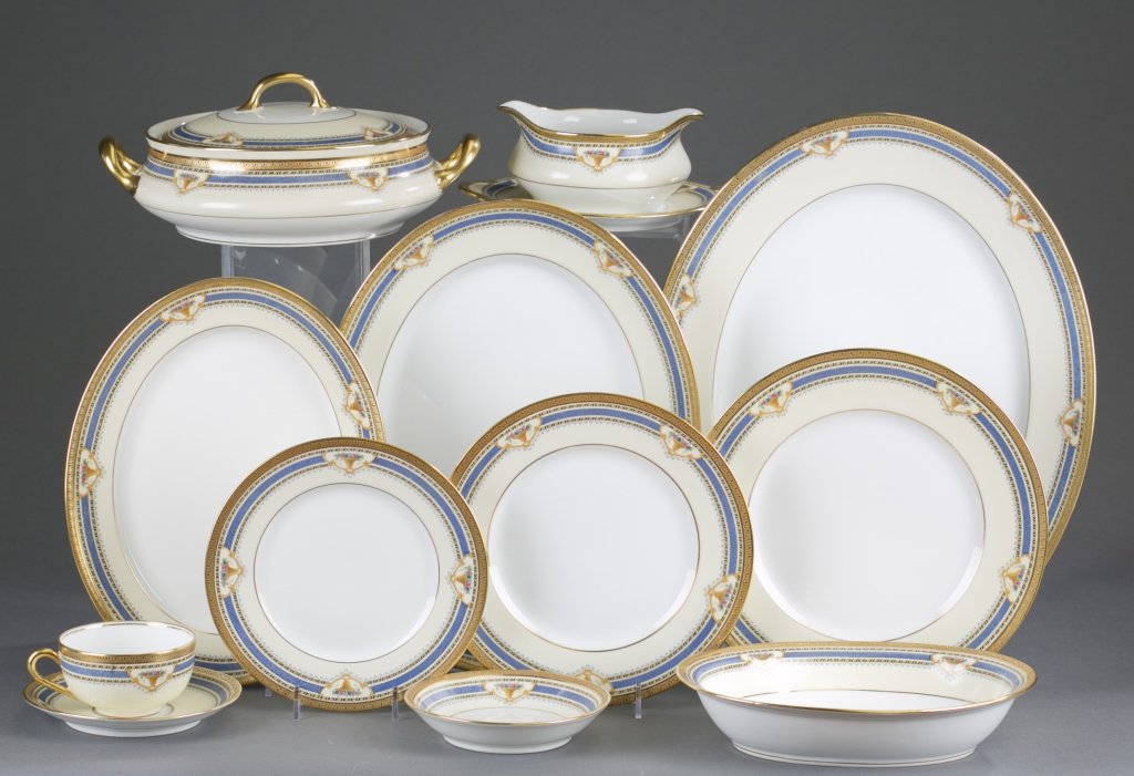 63 Piece Bernardaud & Co. Limoges China Set: Gilt and blue alternating rims with medallions of floral bouquets. 8 10" dinner plates 8 8 1/2" luncheon plates 1 Gravy Boat 1 9 1/2" x 7 1/4" Oval Serving Bowl 6 Coffee Cups 5 Saucers 8 5 1/2"