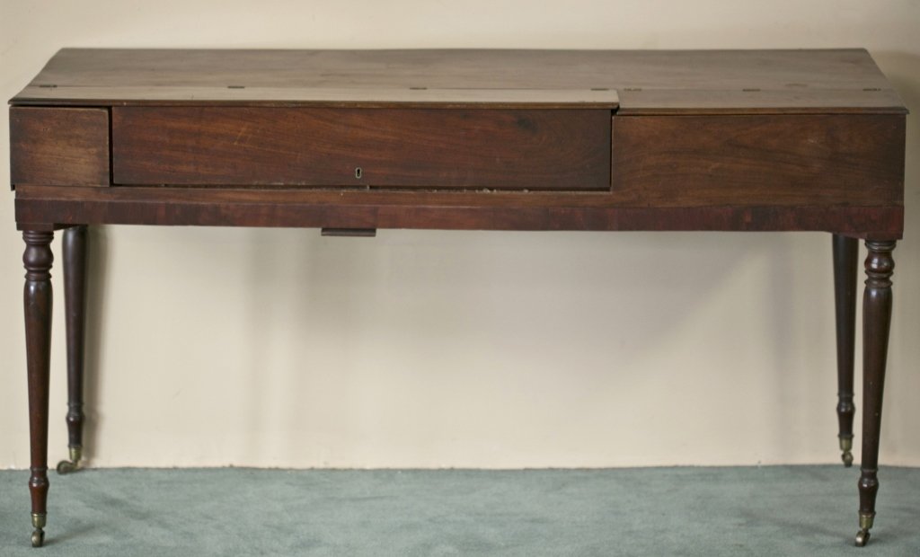 Early 19th c. Baltimore Piano Forte: Mahogany and veneer with poplar and yellow pine secondary. Made by James Stewart. Legs replaced and missing several keys. 34 3/4" H x 66 1/4" L x 23 3/4" D Condition: back right leg damaged