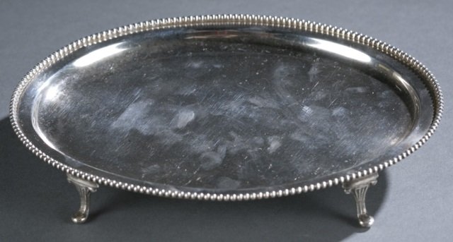 Samuel Kirk & Son Co. Sterling Salver: c.1896-1924, Baltimore, Maryland, small footed oval silver salver with beaded edge. Stamped on verso, " S Kirk & Son Co. 925/1000 / 806." 4.77 ozt.7 1/4" L x 5 1/2" W.
