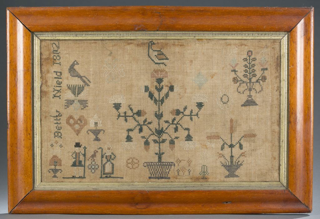 Betty Nield Sampler c.1802.: A sampler worked by Betty Nield, c.1802. Cotton threaded figures & floral works on muslin fabric with signature along left side of the sampler. Not removed from frame. 10 1/2" x 17 1/2" ; frame, 15 1/