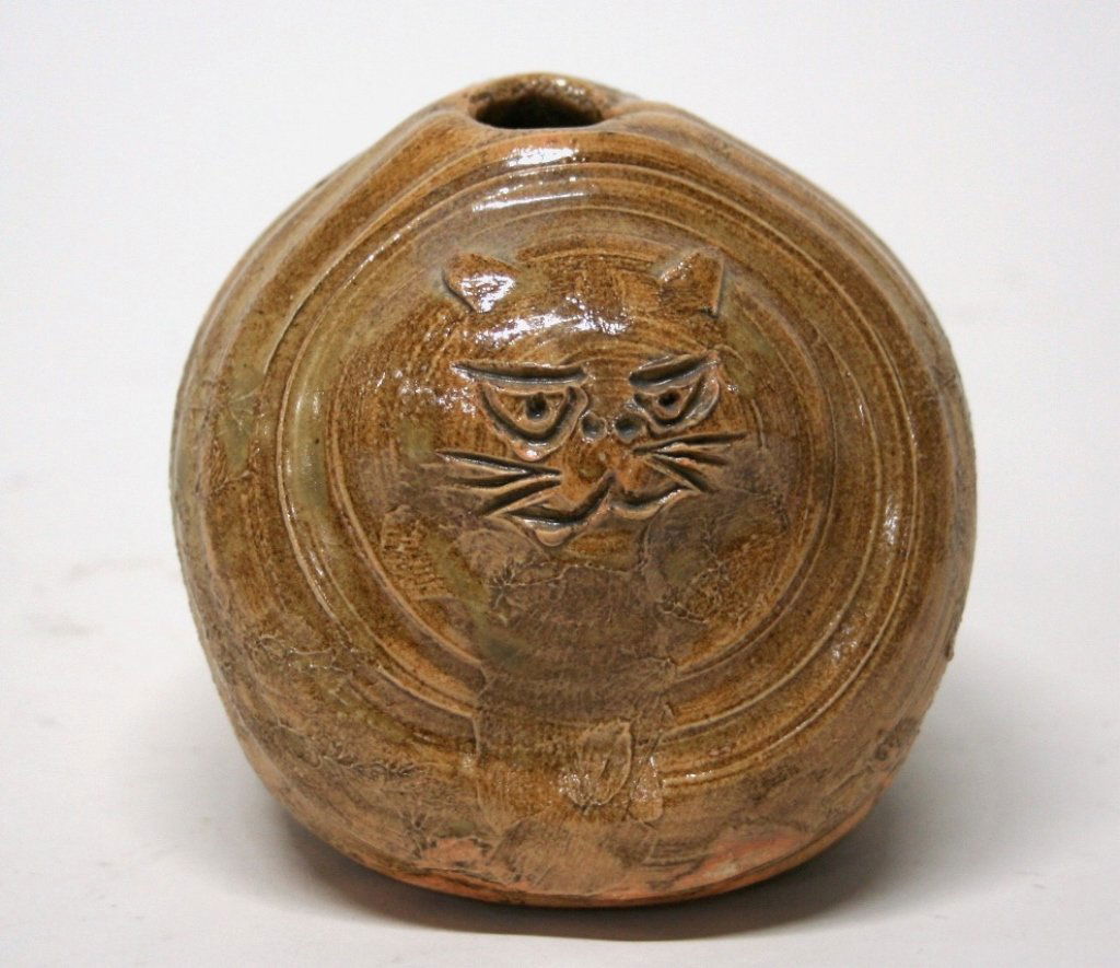 Folk Art Pottery Cat Vase.: Incised cat designed vase with tan glaze. On bottom, impressed illegible artist mark. 4"h.