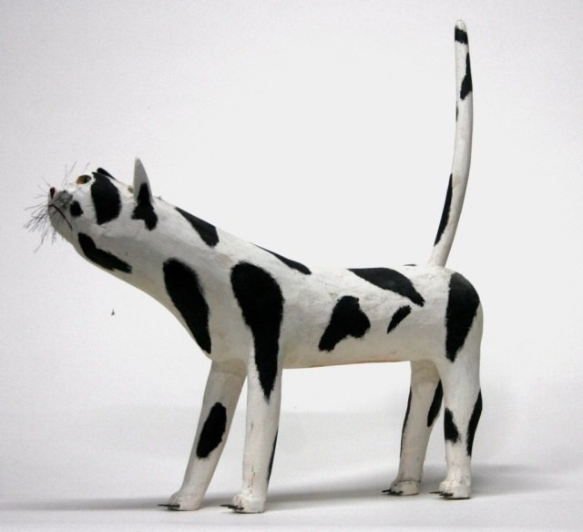 Leroy Archuleta Carved Wooden cat Sculpture.: Carved and polychrome painted cat. On bottom, signed Leroy Archuleta and dated 5-15-98. 26 1/8"h x 25"l x 6"w.