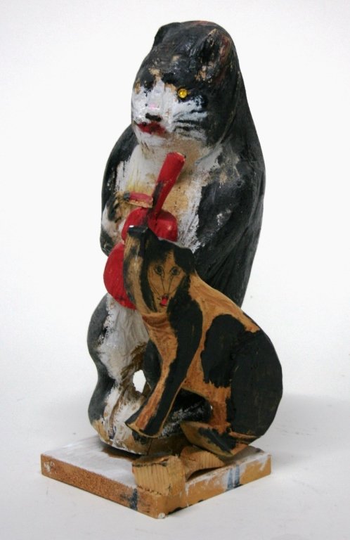 S. L. Jones (US/West Virginia, 1901-1997).: Mixed media folk art cat sculpture made of wood, paint, marker, pencil, and glass. Signed on bottom. 15"h.