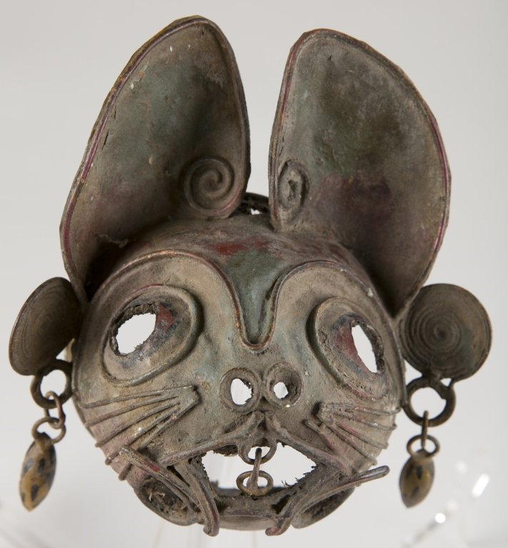 Mexican Folk Art Tin Cat Mask, 20th c.: Formed tin in the shape of a cat. 5 3/4" h.