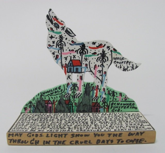 Reverend Howard Finster (US/Georgia, 1916-2001).: "Howling Wolf". Nov. 10, 1990. Polychrome paint and marker on paper on cut wood. On front, titled and signed. On back, signed and dated. 8"h x 8 3/4"w x 3 3/4"d.