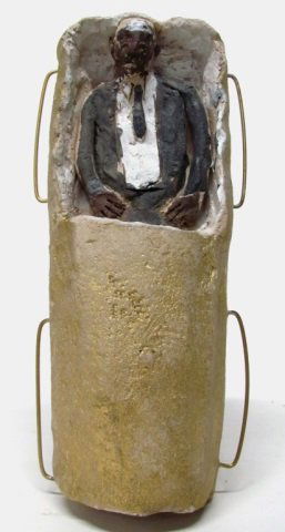 Southeastern Folk Art Man in Casket Figurine.: Polychrome painted clay formed man in casket with wire handles. Unsigned. 2 1/2" h x 9 1/4" l x 3 1/4" w. Loss to paint from age and use.