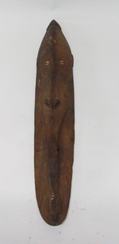 Carved Mask, Sepik River, Papau New Guinea, 20th c.: Carved elongated face with carved bee detail at bottom. With inset seashell eyes. Made for sale. 35" h.
