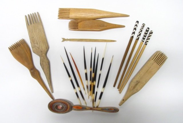 African or Native American Hair Accessories.: Group of porcupine quills. ++ Five carved sticks with porcupine quill tips. ++ Carved wood combs.