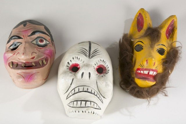 Three Mexican Polychrome Folk Art Masks.: Polychrome painted paper mache face mask. Initialed FAB. 9" h. ++ Polychrome painted paper mache Day of the Dead skull mask. 9 1/4" h. ++ Polychrome painted paper mache animal mask. 11" h.