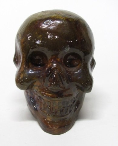Mexican Folk Art Two Faced Ceramic Skull.: A glazed clay two face skull. No marks or signatures. 7"h x 5 1/2"w x 6 7/8"d.