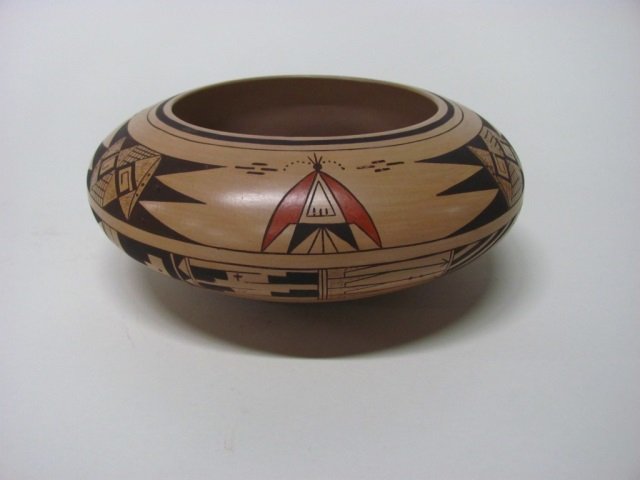 Polychrome Native American bowl.: Polychrome bowl with traditional designs. Faint illegible signature on bottom. 4" h x 9 5/8" diam.