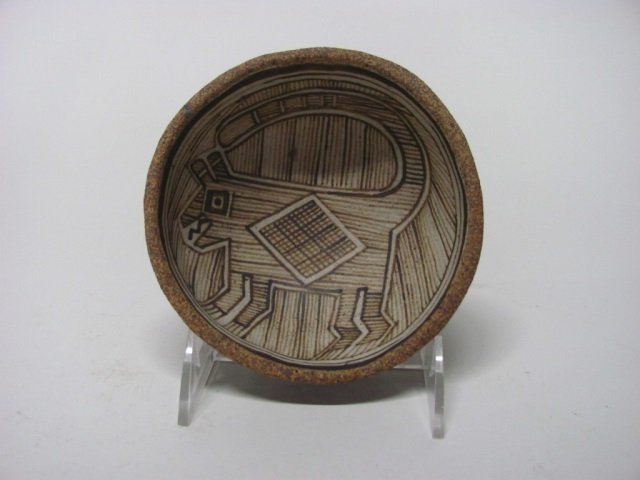 Southwestern Earthenware Polychrome Bowl.: Native American or Folk Art. Felini design on interior. No signature. 2 1/2" h x 5 1/4" diam.
