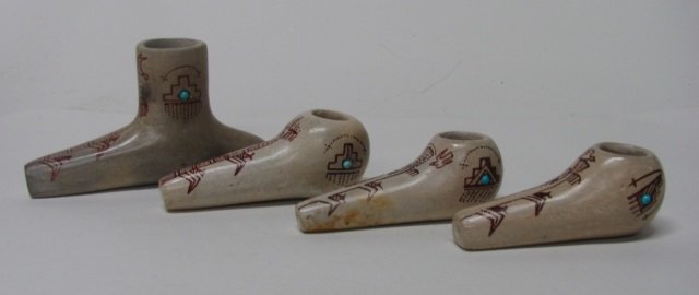 Four Native American Clay Pipes.: Bisque color with tan traditional designs and turquoise beads. Unsigned. Largest: 3" h x 5 3/8" l.