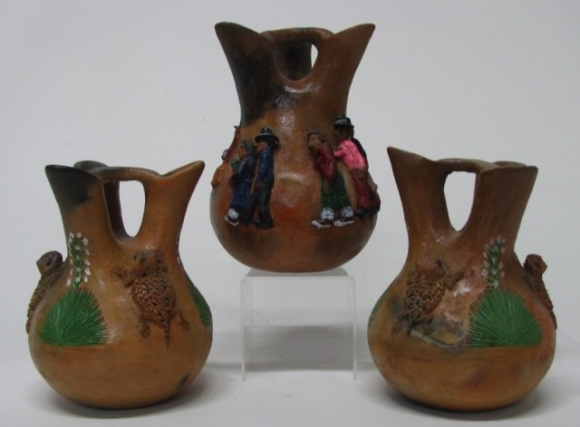 Silas & Bertha Claw (US/Navajo Nation, 20th c.).: Three three-spout clay wedding vases. Navajo couples. Sculpted applique with oil paint and varnish. Signed on bottom 9 3/4" h. ++ Horned toads. Sculpted applique with oil paint and varnish. Signed on 