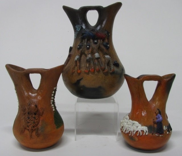 Silas & Bertha Claw (US/Navajo Nation, 20th c.).: Three two-spout clay wedding vases. Traditional Native Americans. Sculpted applique with oil paint and varnish. Signed on bottom 9 3/4" h. ++ Horned toads. Sculpted applique with oil paint and varnish