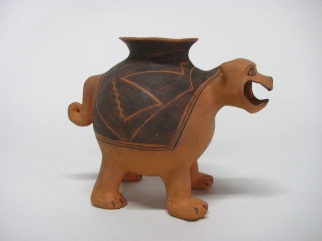 Gregory Holiday (US/Navajo Nation, 20th c.).: Mountain lion effigy form with organic clay and paint. Artist's symbol on underside. 8" h x 10 1'4" l x 6 1/8" w.
