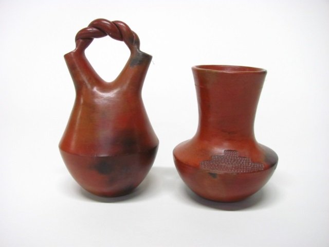 Susie Williams Crank (US/Navajo Nation, 20th c.).: Braided handled wedding vase. Signed on bottom. 8 3/8" h. ++ Redware vase with incised designs on shoulder. Signed on bottom. 6 3/8" h. Crank is the daughter of Rose Williams.