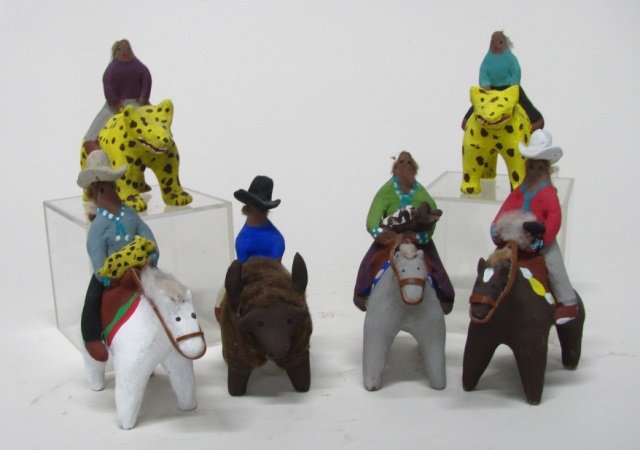 Group of Six Native American Miniature Figurines.: Three are riding horses, one is riding a buffalo, and two are riding felines. No marks or signatures. Three are missing their cowboy hats. Tallest: 5 1/2"h.