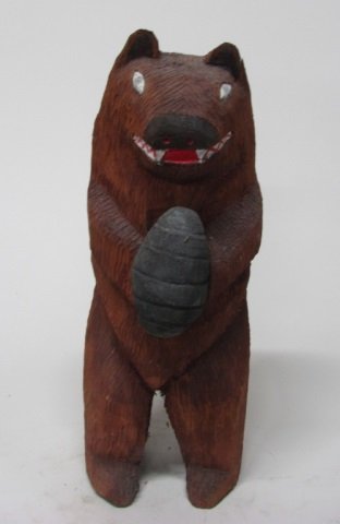 Robin Wellito (US/Navajo Nation, 20th c.).: 1994. Polychrome painted carved wood sculpture of a bear holding a bee hive. On bottom, signed and dated. 21 1/2" h.