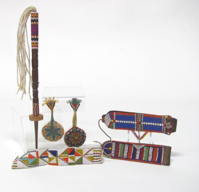 Native American Beadwork Accessories.: Beadwork belt loops. One with metal charm. Beadwork bracelet in polychrome beads. ++ Two round headband beaded discs. ++ Hand carved and beaded dance totem. ++ Some beads missing from age & use.