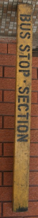 Vintage Hardwood Sign,: "Bus Stop Section " Yellow and Black painted hardwood,