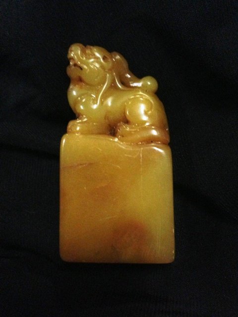 A Chinese Figural Soapstone Chop, ,: modelled in typical form surmounted by a single pixiu , h 5.25