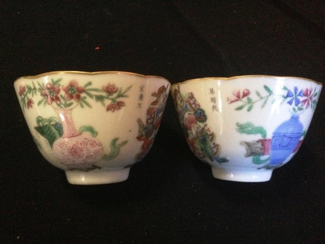 A Pair of Qing Famille Rose Bowls,: each modelled with deep bowls, painted with a single figure of a warrior , flanked by script and floral sprays, AF, d 10cm