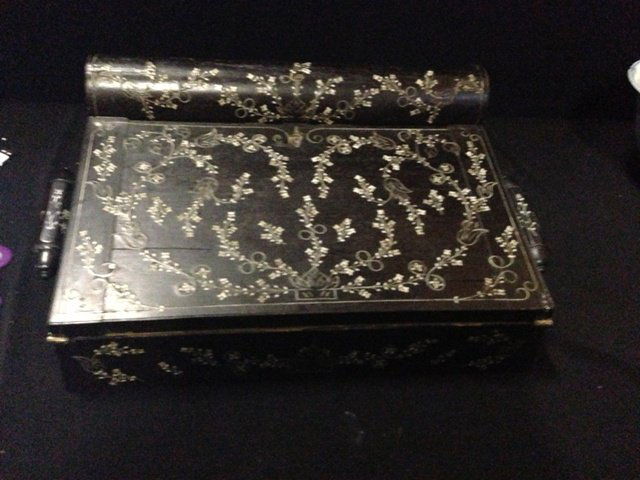 An Anglo Indian Ivory and Ebony Writing Slope: 19th Century , modelled with a cushion moulded hinged top , leading to a further hinged writing slope , enclosing storage , l 34.5cm d 24.75cm h 15cm