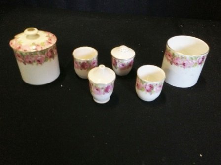 A Selection of Royal Doulton English Rose Design , ,: including two preserve pots, one with original lid , salt and pepper shakers , and two egg cups (6)