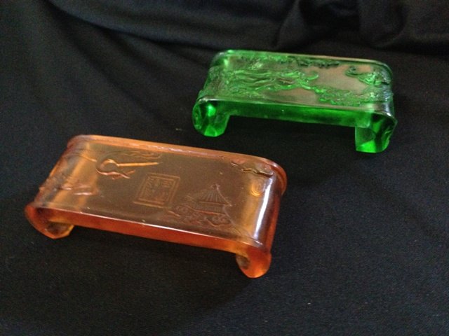 A Selection of Peking Glass Stands: each modelled in the form of chinese side tables, with raised decoration and scrolled supports , l 8.5cm one aft