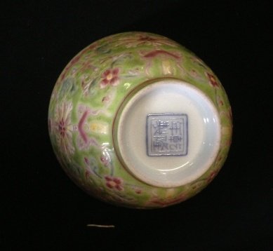 A Chinese Famille Verte Wine Cup , Possibly Qing: richly enamelled with styalised flowers and bats on an apple green ground , four charater mark to base , d 8.25cm