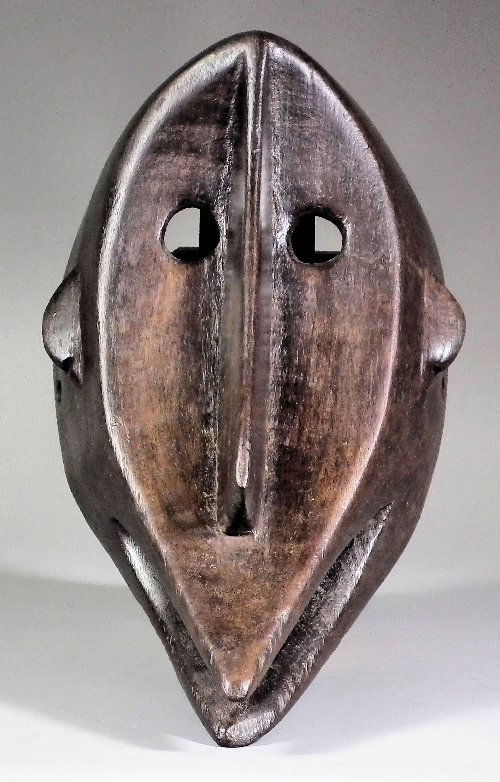 A Bambara Mask (Mali - Niger) - Plain hardwood ovo: A Bambara Mask (Mali - Niger) - Plain hardwood ovoid mask with elongated nose and chin, 13.75ins high