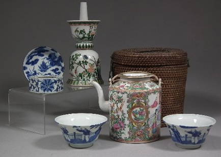 A Chinese 'Cantonese' porcelain cylindrical teapot: A Chinese 'Cantonese' porcelain cylindrical teapot and cover enamelled in colours with figures on terraces, within floral borders, with string bound handle, 6ins (153mm) high, metal bound cane insulat