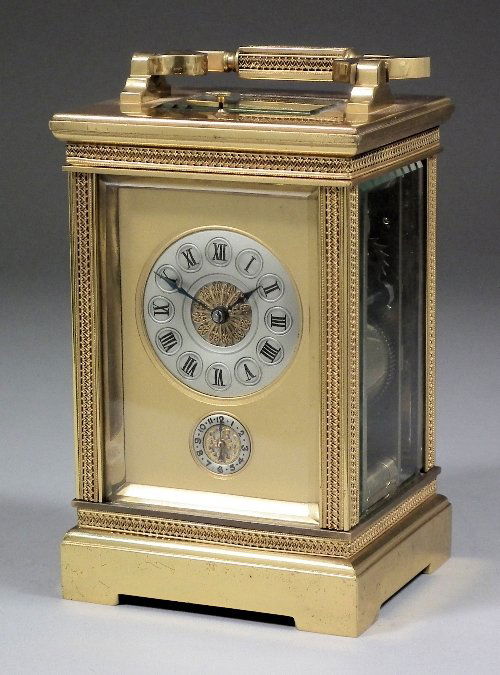 A late 19th Century French Grand Sonnerie carriage: A late 19th Century French Grand Sonnerie carriage clock with alarum, the 2ins diameter silvered dial with Roman numerals in circular cartouches to the eight day two train quarter repeating movement s
