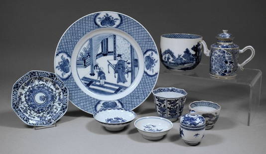 A Chinese blue and white porcelain octagonal cup and sa: A Chinese blue and white porcelain octagonal cup and saucer, the exterior panels painted with various flowers, cup 2.75ins (70mm) high (Kangxi period - chipped to cup), a Chinese blue and white porcel