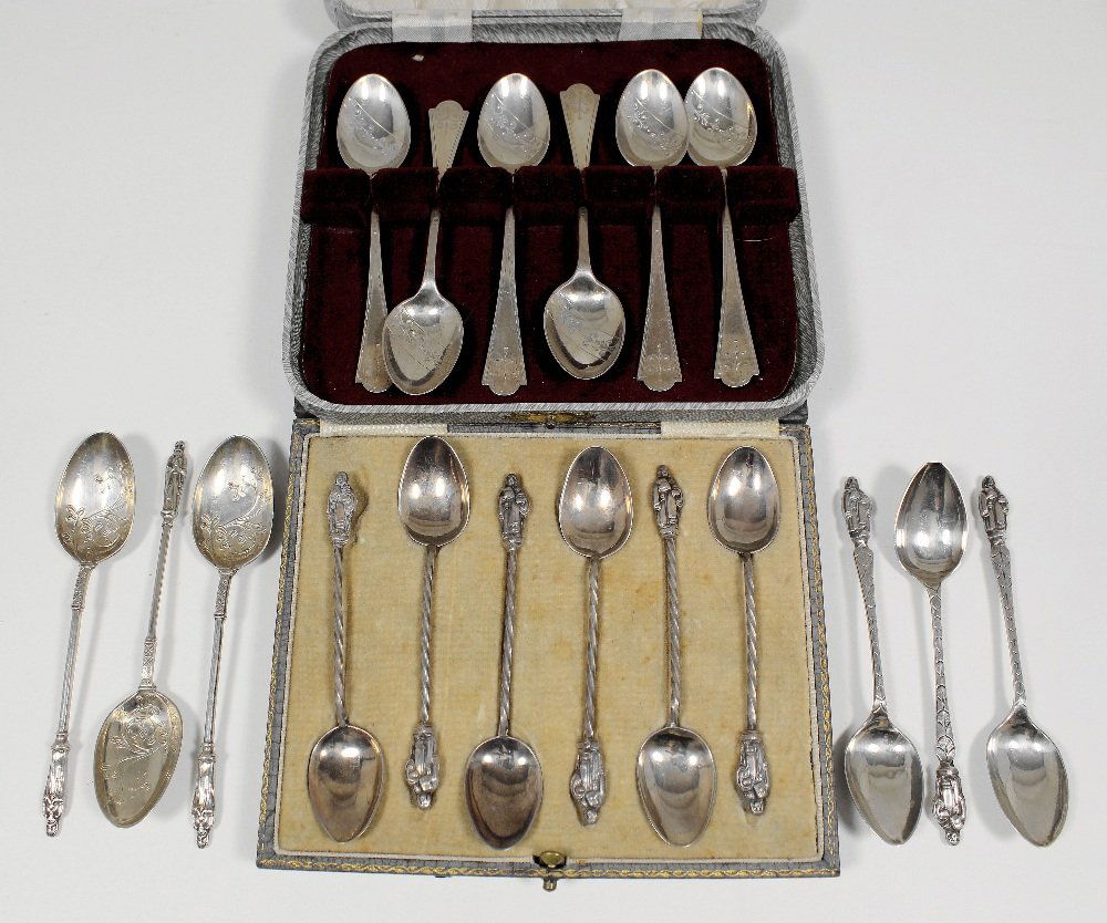 A set of six silver Victorian tea spoons with “Apostle”: A set of six silver Victorian tea spoons with “Apostle” pattern terminals, the bowls engraved with scroll work, by Mappin & Webb, Sheffield 1892, two sets of silver tea spoons in fitted cases, and