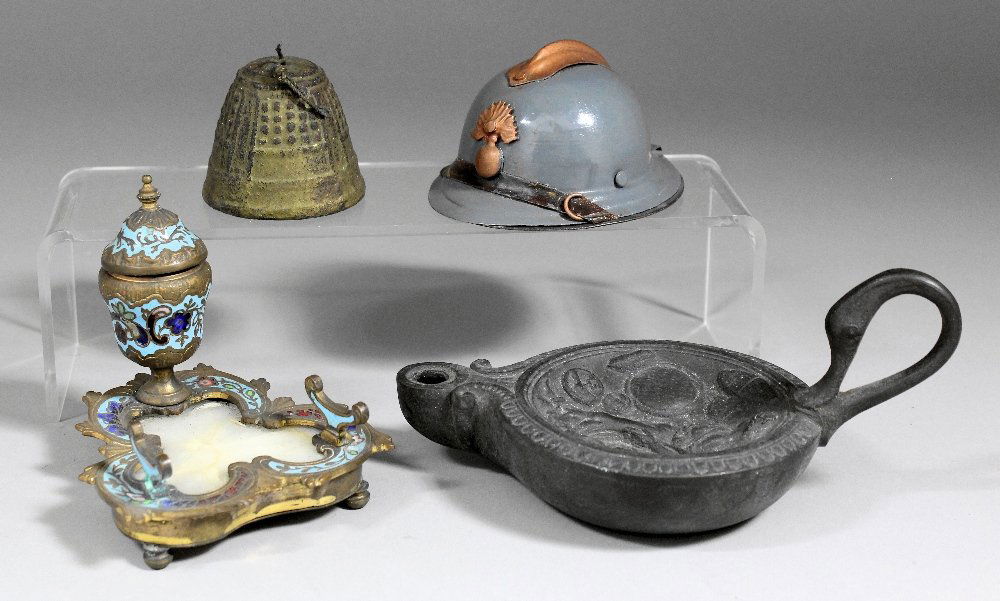 An early 20th Century painted tinplate “Fireman’s Hat” : An early 20th Century painted tinplate “Fireman’s Hat” pattern inkwell, 1.75ins high, a late 19th Century gilt metal and champleve enamelled inkstand of shaped outline inset with alabaster, 3ins