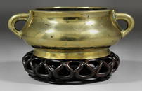 A Chinese bronze circular two-handled censer, 4.75ins (